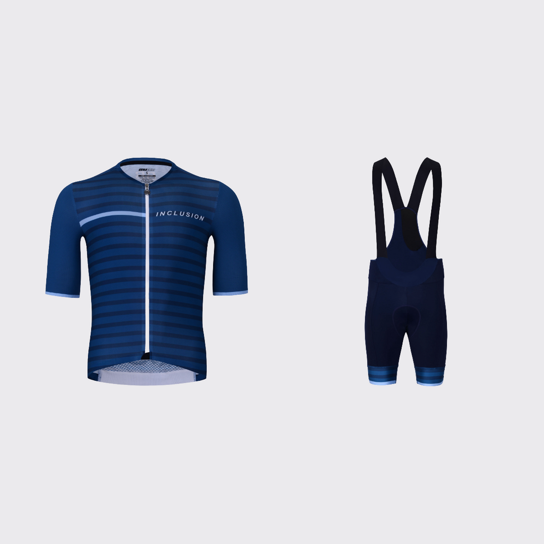 Best Buddies cycling kit featuring a navy blue short-sleeve jersey with horizontal tonal stripes, a white zipper, light blue chest stripe, and INCLUSION lettering, paired with navy bib shorts with black straps and matching striped blue leg cuffs.