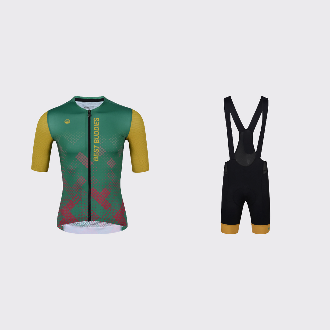 Best Buddies cycling kit featuring a green short-sleeve jersey with gold sleeves, vertical BEST BUDDIES lettering, and red halftone graphics, paired with black bib shorts with black straps and matching gold leg cuffs.