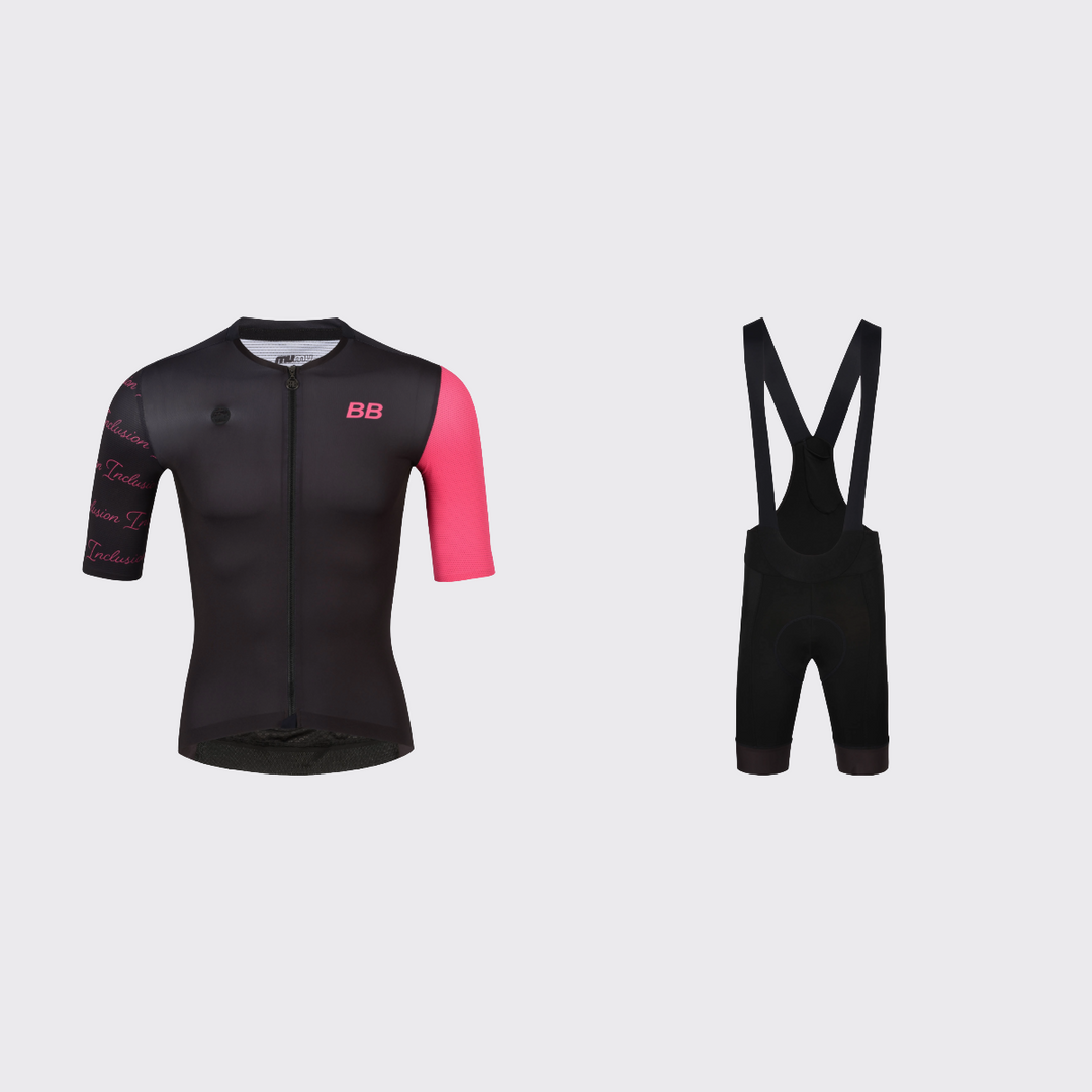 Best Buddies cycling kit featuring a black short-sleeve jersey with bright pink BB branding, one pink sleeve, and repeated INCLUSION script on the opposite sleeve, paired with black bib shorts and black shoulder straps.