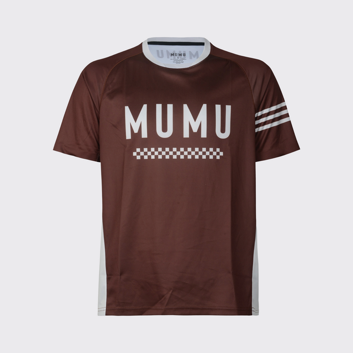 Brown short-sleeve MTB jersey with a relaxed fit, large white MUMU branding across the chest, a white checkered graphic below, three white sleeve stripes, and white side panels, shown against a light gray background.
