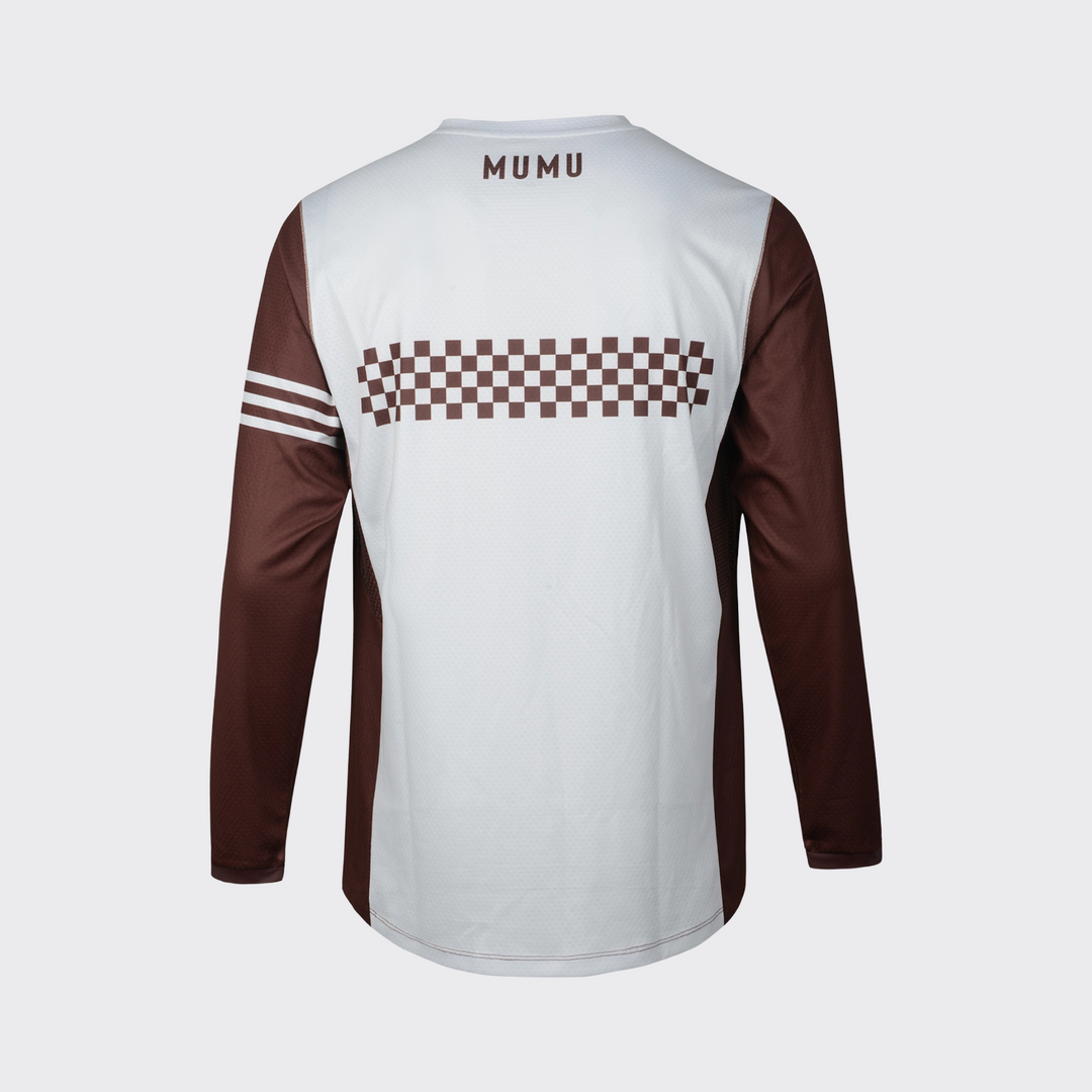 White and brown long-sleeve MTB jersey shown from the back, featuring a relaxed fit, brown sleeves and side panels, a brown checkered graphic across the upper back, three white sleeve stripes, brown MUMU branding below the collar, and a slightly extended rear hem, shown against a light gray background.
