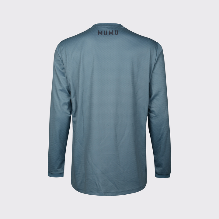 Slate blue long-sleeve MTB jersey shown from the back, featuring a relaxed fit, subtle textured performance fabric, long sleeves, and black MUMU branding centered below the collar, shown against a light gray background.
